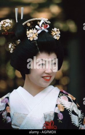 Japanese bride wearing traditional kimono gown & shimada hairstyle smiles after getting married at the Meiji shrine, Tokyo,Japan Stock Photo