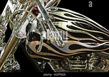 low angle side view photo of the front forks handlebars engine seat and tank of a custom chopper motorcycle Stock Photo