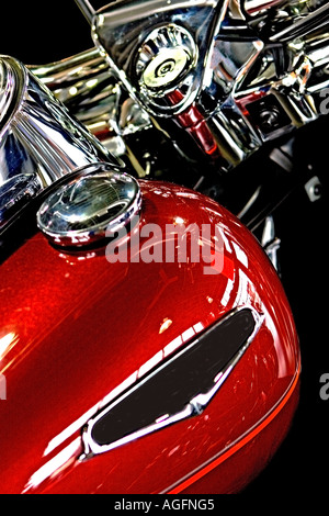 Low angle side top view photo of handlebars and tank of a custom chopper motorcycle Stock Photo