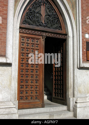 Old wooden door on Piazza Roma in Asti Piedmont Nortern Italy Stock Photo