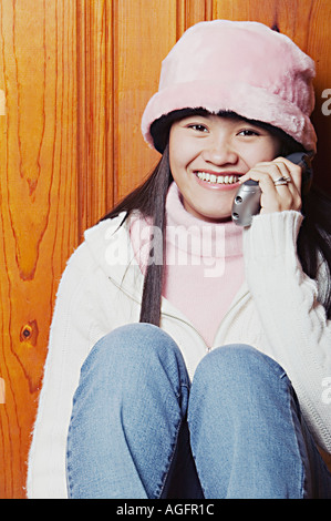 Young Woman Smiling Listening on Phone Stock Photo