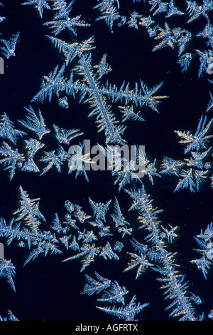 frost on window pane forming cross shape Stock Photo
