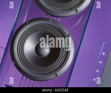 Loudspeaker cone in clear glass housing Purple background Stock Photo