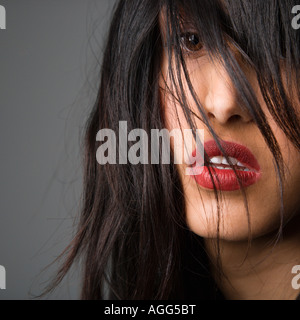 Headshot of pretty young woman with long black hair Stock Photo