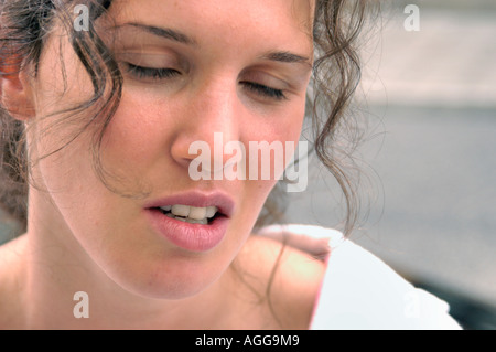 tired and unhappy woman having conversation Stock Photo