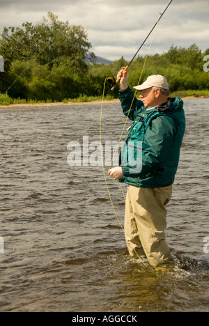 Alaska Southwest Fly fisherman casting for Tout and Salmon while ...