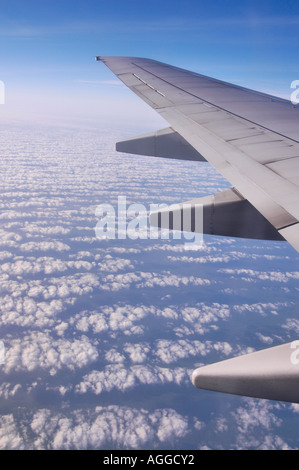 Jet above the clouds Stock Photo - Alamy