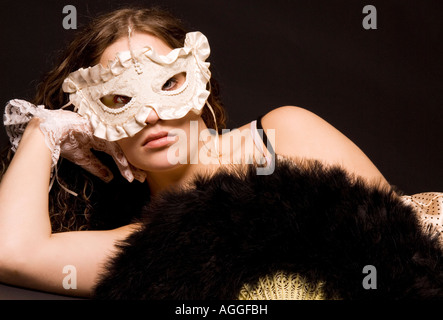 Beautiful Young Woman (18-25) wearing White Mask Stock Photo