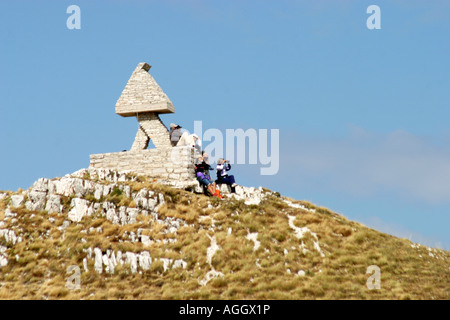 Hikers resting on a mountain ridge in the Sibillini Mountain Range ,Le Marche Italy Stock Photo