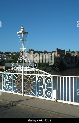 Ornate lamp post marks boundary of England & Wales on Old Wye Bridge at Chepstow crossing River Wye castle beyond Monmouthshire Gloucestershire UK Stock Photo