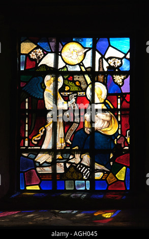 Stained glass window in the 11th century church of Saint Issui Partricio Partrishow Monmouthshire South Wales UK Stock Photo