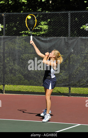 Female high school tennis action Stock Photo