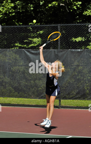 Female high school tennis action Stock Photo