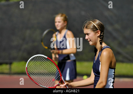 Female high school tennis action Stock Photo