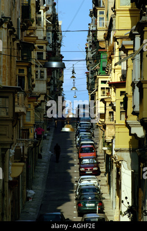 Typical narrow street ( St Paul's Street ) in Valletta the capital city of Malta island Stock Photo