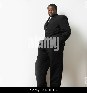 Image of afro american man in suit with hands in pockets Stock Photo