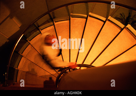 man walking up stairs Stock Photo
