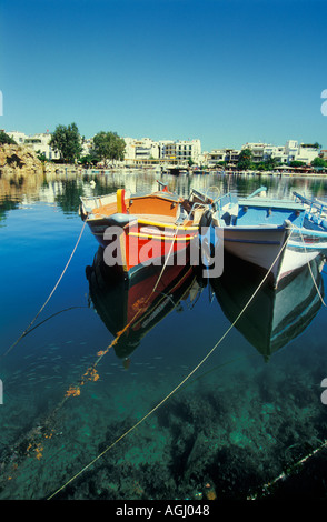 Fishing boats on Lake Voulismeni Agios Nikolaos Crete Greece EU Europe eye35.com Stock Photo