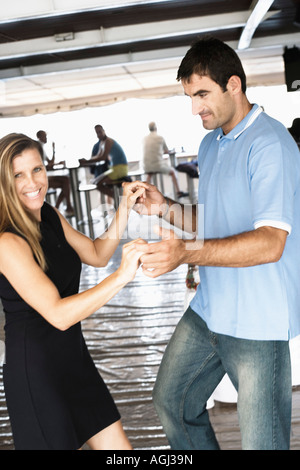 Mid adult couple dancing in a nightclub Stock Photo