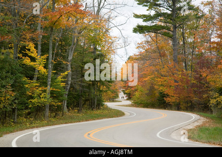 Stretch of road just west of the ferry landing that services Washington Island (Door County)  with fall colors in October. Stock Photo