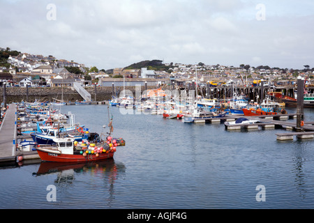 Fishing boats moored in the busy harbour at Newlyn in Cornwall Stock Photo