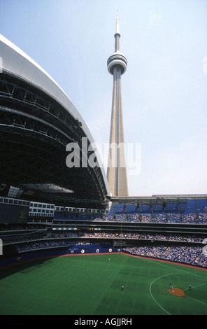 CN tower in Toronto,the World's second tallest building,at a staggering 1815ft.5inches dominating the  Skydome baseball stadium Stock Photo