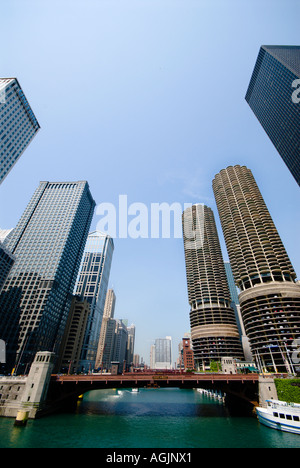 The twin round towers of Marina City dominate the incredible architecture along the Chicago River in downtown Chicago Illinois Stock Photo