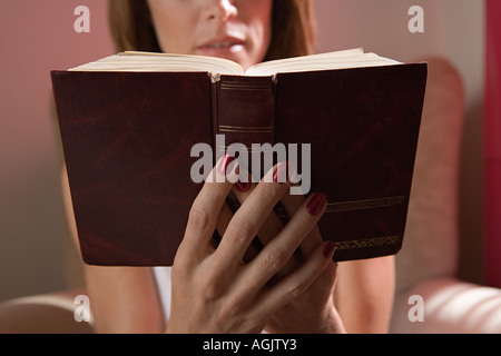 Woman reading the bible Stock Photo