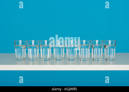 Eight glasses of water Stock Photo