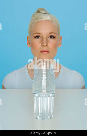 Young woman with glasses of water Stock Photo