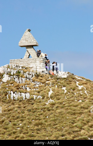 Hikers resting on a mountain ridge in the Sibillini Mountain Range ,Le Marche Italy Stock Photo