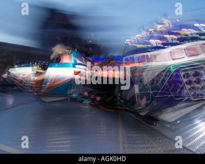 People in fast spinning ride on the yearly fun fair fairground in ...