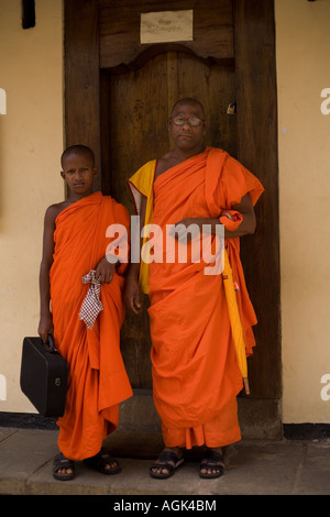 Boudhist monk studying phylosophy of therevada from nirvana sutra in Malwatte temple Stock Photo