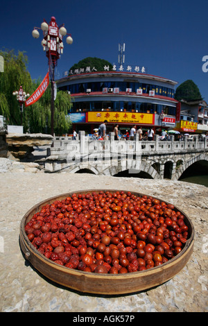 Fruit drying by the side of the river in Yangshuo Guangxi Prrocince Stock Photo