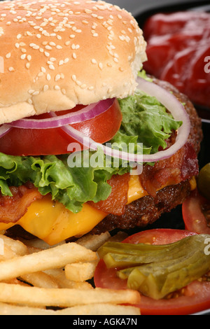 Hamburger with French Fries Beef burger on a plate American fast food overhead from above close up closeup pictures images vertical in USA US hi-res Stock Photo