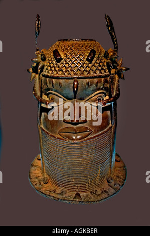 18th-to-19th-century cast-brass commemorative head of an Oba (King) with a flanged base and wing-like headdress projections Kingdom of Benin Kingdom Stock Photo