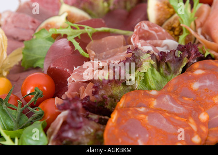 Selection of cold meats with salad Stock Photo