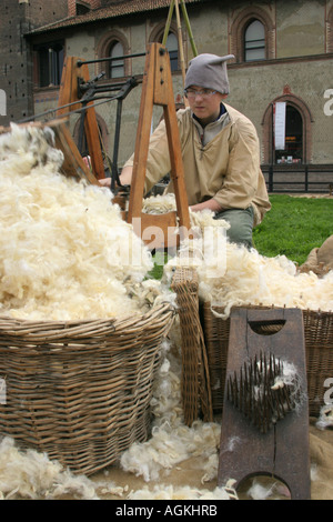 A man spinning wool during a revive of ancient crafts, Milan, Italy Stock Photo