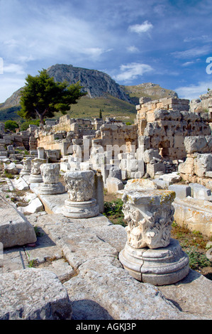 Ruins of the ancient city of Corinth with the Acropolis of Acrocorinth overlooking the ancient city of Corinth Greece Stock Photo