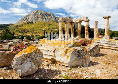 Ruins of the ancient city of Corinth with the Acropolis of Acrocorinth overlooking the ancient city of Corinth Greece Stock Photo