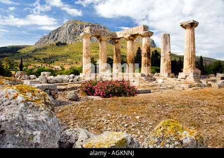 Ruins of the ancient city of Corinth with the Acropolis of Acrocorinth overlooking the ancient city of Corinth Greece Stock Photo