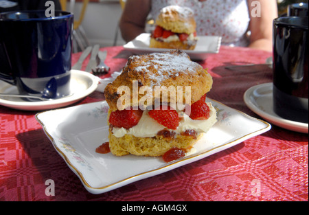 A DEVONSHIRE CREAM SCONE  WITH STRAWBERRIES RE FOOD CALORIES DIETS DIETING SUGAR OBESITY ETC UK Stock Photo