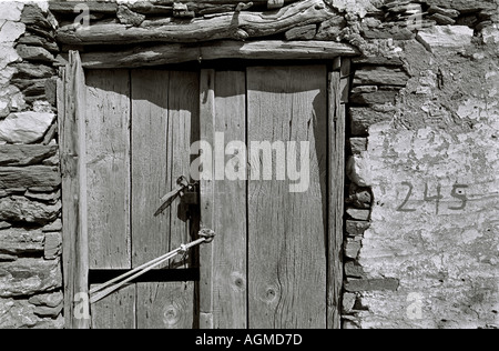Old wooden door at number 245, Paros Greece Stock Photo