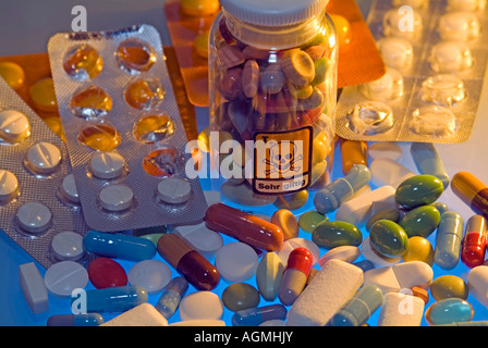 medicin many pills bottle with symbol for poison skull and crossbones Stock Photo