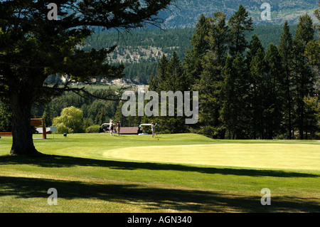 Playing golf in the mountains Stock Photo