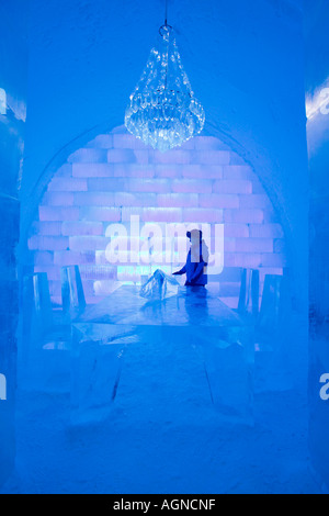 A person at a dinner table ice sculpture inside the Ice hotel Jukkasjarvi Sweden Stock Photo