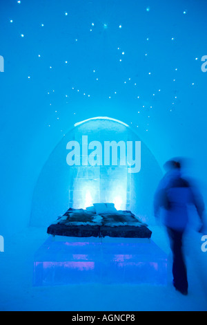 A person in a room in the Ice hotel Jukkasjarvi Sweden Stock Photo