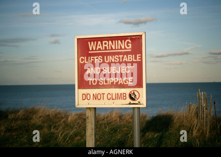 Warning sign of cliffs erosion at Walton on the Naze, Essex, England, UK Stock Photo