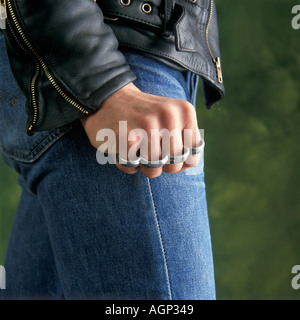 aggressive hand with knuckle duster Stock Photo