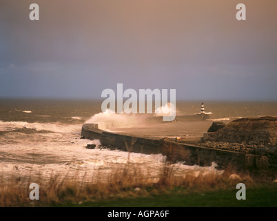 Stormy winter sea breaking on a breakwater; Seaham harbour, County Durham, England, UK . Stock Photo